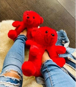 A Teddy Bear Slippers and Pink Duffle Bag
